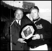 Mickey Mantle receives his third Most Valuable Player Award for the 1962 season from baseball commissioner Ford Frick on opening day in 1963. Mickey was also the MVP in 1956 and 1957.