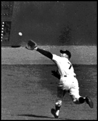 Oct. 8, 1956: Mickey Mantle races after Gil Hodges' line drive to deep left-centerfield in Game 5 of the 1956 World Series at Yankee Stadium. Mickey made a spectacular back-handed catch to rob Hodges of an extra-base hit to save Don Larsen's perfect game, the only perfect game in World Series history. Mantle also homered to give the Yankees their first run.