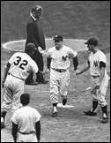 May 6, 1962: Mickey Mantle is congratulated by Roger Maris and Elston Howard (32) after he belts his third home run of the day in a doubleheader at Yankee Stadium against the Senators. Roger Maris hit back-to-back home runs with Mickey in the second game.
